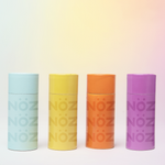 Load image into Gallery viewer, Front view of Noz stick sunscreen in different shades (Blue, Yellow, Orange, and Purple)
